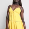 Cotton tiered v-neck mini dress Cotton tiered v-neck mini dress