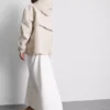 Short cinched rain jacket