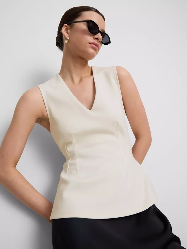V-neck peplum sleeveless top V-neck peplum sleeveless top