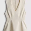 V-neck peplum sleeveless top V-neck peplum sleeveless top